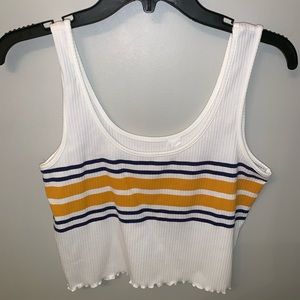 White crop top with yellow and blue strips